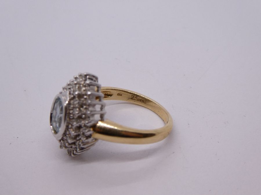 Contemporary 9ct gold aquamarine and diamond cluster ring in a marquise shaped mount, central oval a - Image 4 of 6