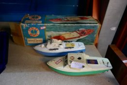 Scalex boxed speedboat, and two other tinplate examples