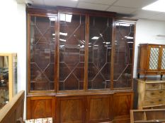 A Georgian style mahogany break-front bookcase, the glazed top having Astragal doors on later cupboa