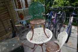 A Victorian style garden table and a pair of chairs