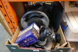 A selection of mostly Microsoft gaming equipment, including steering wheel, joysticks, etc