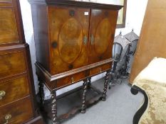 An early 20th century cupboard on stand having two drawers with lower stretcher, 82cm