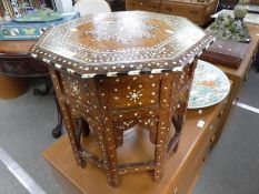 A small Anglo - Indian octagonal table, decoration on folding base, 41cm