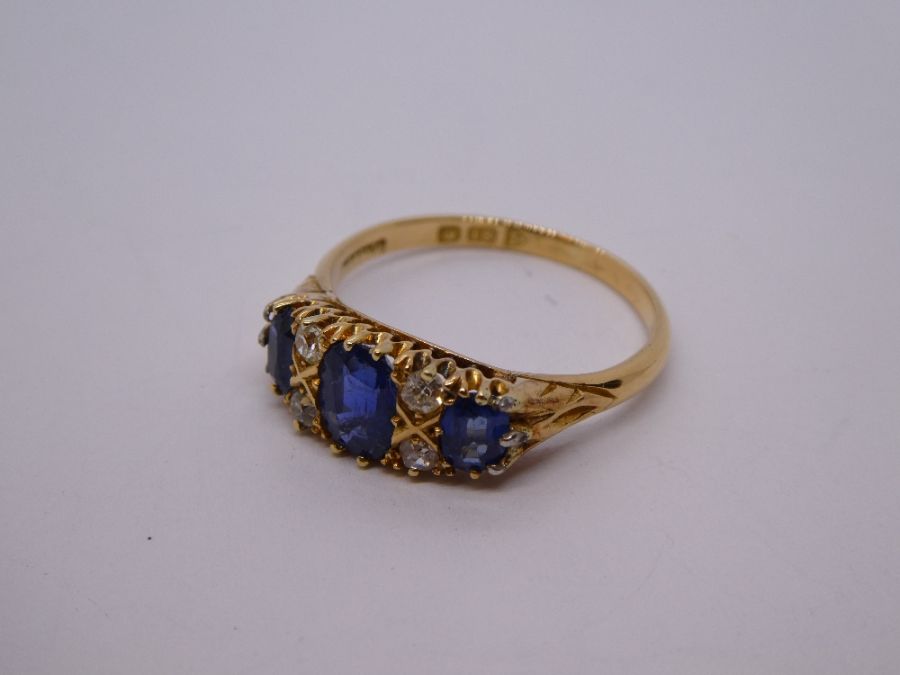 Antique Sapphire and diamond ring with central oval blue sapphire flanked diamonds and smaller oval - Image 5 of 11