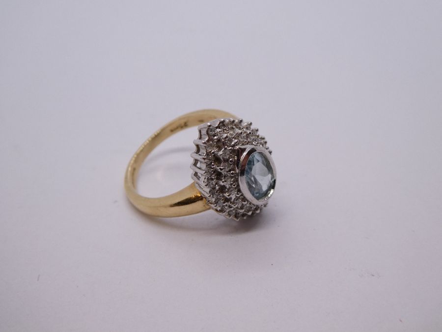 Contemporary 9ct gold aquamarine and diamond cluster ring in a marquise shaped mount, central oval a - Image 6 of 6