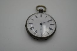 A small fine silver pocket watch of engine turned design. A very nice item, marked fine silver