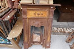 Two Victorian cast iron fireplaces