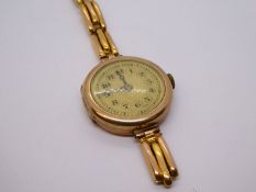 9ct yellow gold antique circular faced wristwatch on 9ct yellow gold strap, Af, 19.2g approx