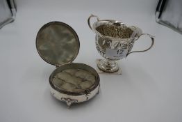 A very decorative Victorian half reeded and embossed two handled cup on a square foot. Foliate detai