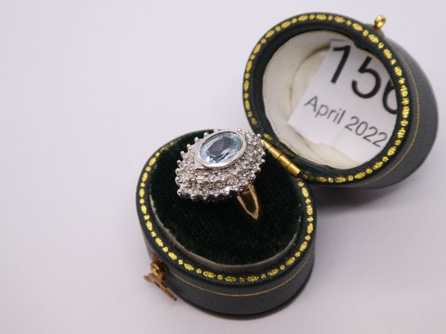Contemporary 9ct gold aquamarine and diamond cluster ring in a marquise shaped mount, central oval a - Image 2 of 6