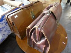 A desk lamp and 2 leather briefcases