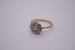 18ct and platinum diamond nine stone diamond cluster ring, central diamond 0.23ct surrounded by eigh