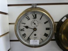 An old brass ship's clock, by Sestrel