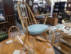 Ercol, a stick back rocking chair having open arms