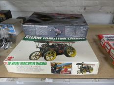 A Bandai steam traction engine model (Partially built) and two R/C off road racer kits by Kyosho