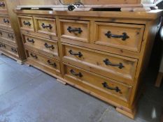 A Mexican pine long chest, having 4 short and 4 long drawers