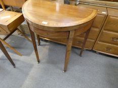 An antique mahogany foldover console table having crossbanded top