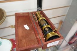 An old pocket microscope in wooden case