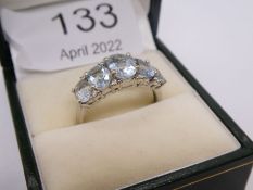 Modern 9ct white gold aquamarine and diamond dress ring comprising 5 large oval graduating aquamarin