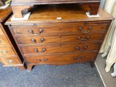 A Georgian mahogany chest, having 4 long graduated drawers with brushing slide on graduated legs