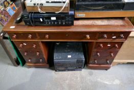 A Victorian mahogany twin pedestal desk having nine drawers