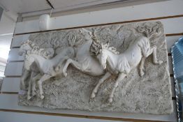A modern resin plaque of 4 horses