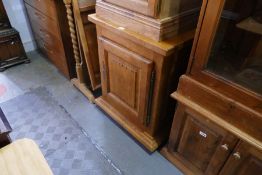 A reproduction Oak cupboard of French style, and a modern pine cupboard
