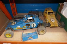 A selection of vintage petrol engined remote control cars, controllers, starters, etc and a box of s