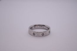 Platinum wedding band inset with 8 round cut diamonds, marked CJ, 950, Birmingham, size Q/P, approx