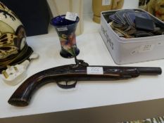 An antique Flintlock pistol