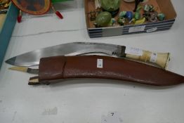 A vintage Kukri, having bone handle and bone handle accessories