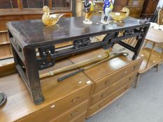 A Chinese hardwood oblong coffee table (some damage) 121cms