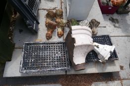 A set of four Victorian bath feet, old hoppers, grates and sundry