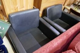 A pair of modern barber style revolving armchairs, on chrome base