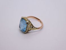 9ct yellow gold dress ring with large pale blue stone, size P, marked 9ct