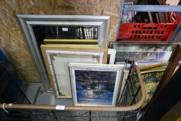 An oblong mirror having silver frame and a quantity of pictures