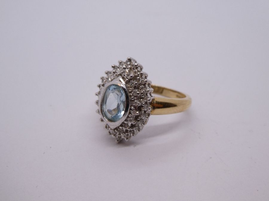 Contemporary 9ct gold aquamarine and diamond cluster ring in a marquise shaped mount, central oval a - Image 3 of 6