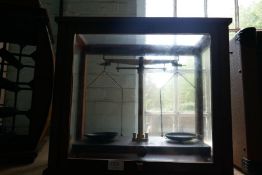A set of Chemist scales in glazed case by Griffin and George