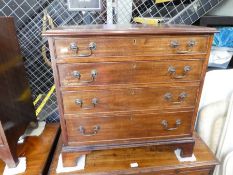 An early 20th century small chest having 4 long drawers and one later example