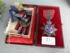 A King Edward VII Imperial Service Medal in fitted case and two World War II medals