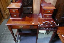 A mahogany dressing table on turned legs