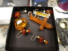 Small collection of silver amber costume jewellery including pendants, earrings, quartz cross pendan