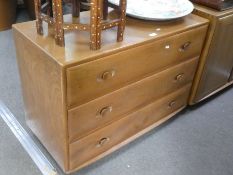 Ercol, an elm chest having three long drawers