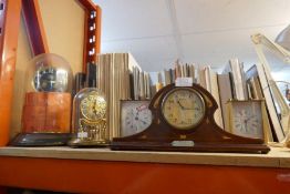 A selection of mantle clocks including doomed examples, made in Germany, and an 8-day Swiss made clo