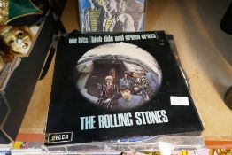 A small selection of vinyl LPs including Queen, Rolling Stones and a Six Pack limited edition blue v
