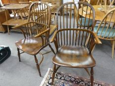 A pair of antique style Windsor stick back armchairs