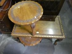 A Burmese style carved oblong coffee table and two similar circular tables