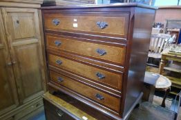 A reproduction mahogany chest having 4 long drawers