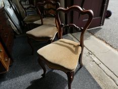 A set of 4 Victorian Rosewood Balloon back dining chairs