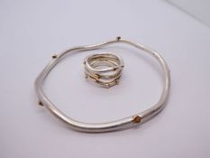 Rauff of Denmark; a Sterling silver and gold contemporary design bracelet and similar ring both stam